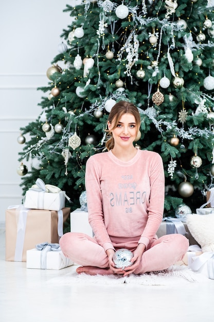 beautiful young woman at home in christmas time
