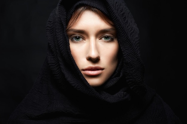 Beautiful young woman in hood or hijab