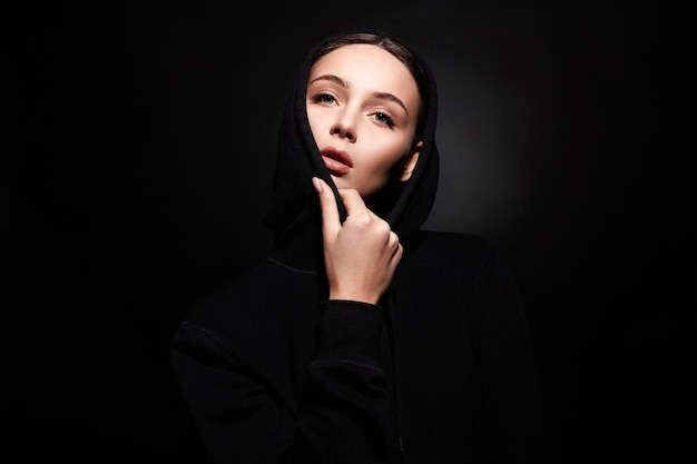 Beautiful young woman in hood model hipster girl