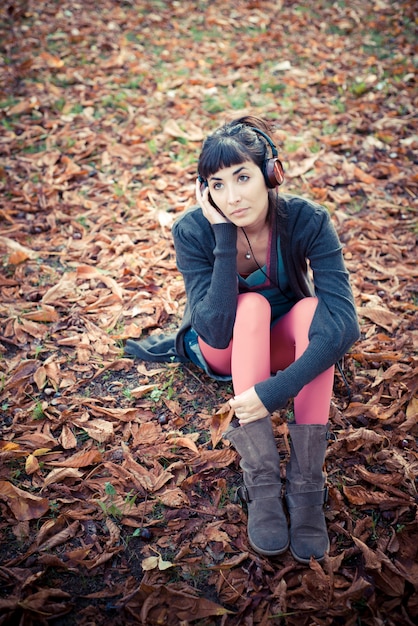 beautiful young woman listening to music