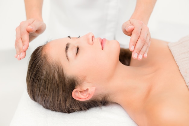 Beautiful young woman on massage table