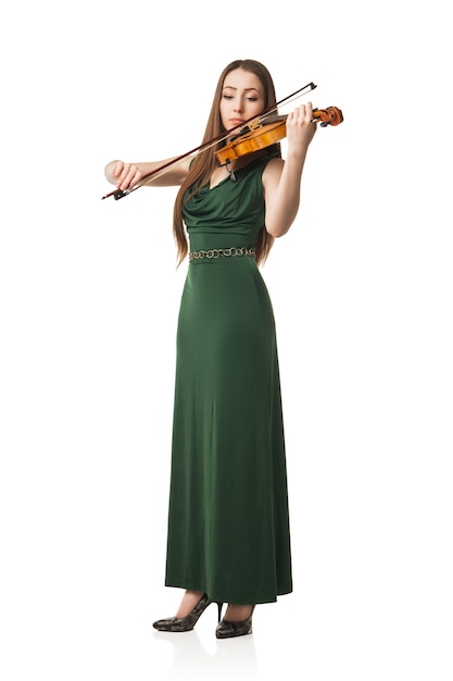 Beautiful young woman playing violin over white background