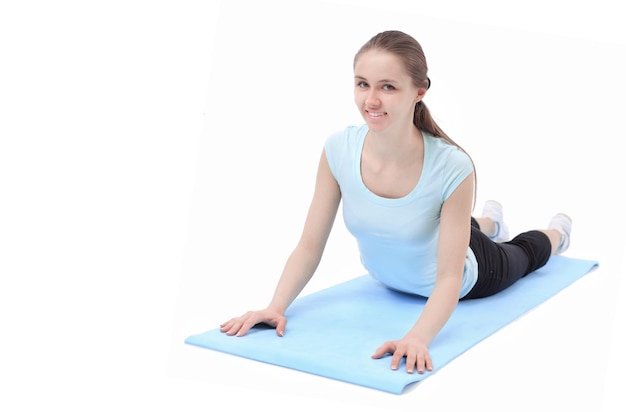 Beautiful young woman plays sports on a white background