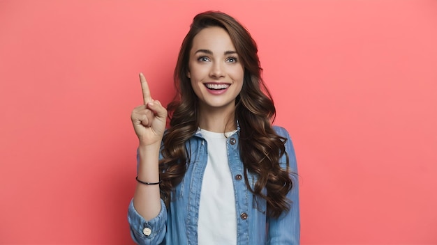 Beautiful young woman pointing up over white background