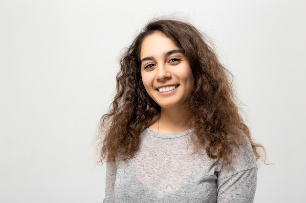 Beautiful young woman portrait Indoor portrait of beautiful brunette with shaggy hairstyle