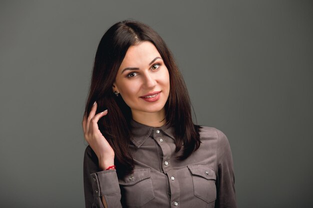 Beautiful young woman portrait Portrait of a girl in the studio on a neutral background