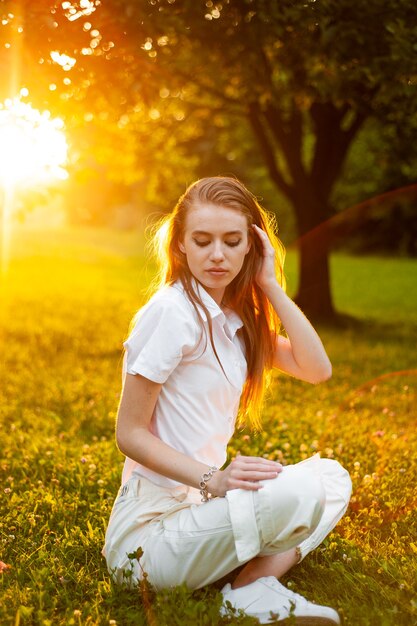 Beautiful young woman portrait on sunset