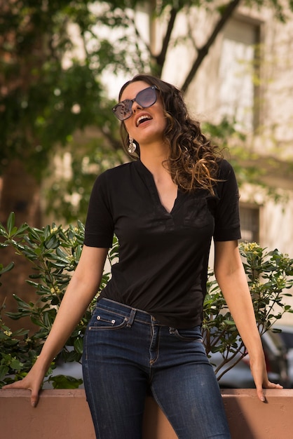 Beautiful young woman posing in the city