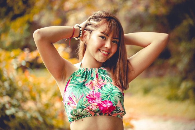 beautiful young woman posing in a natural landscape