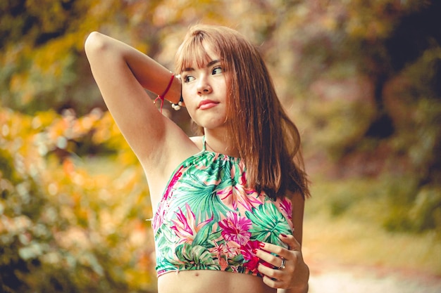 beautiful young woman posing in a natural landscape