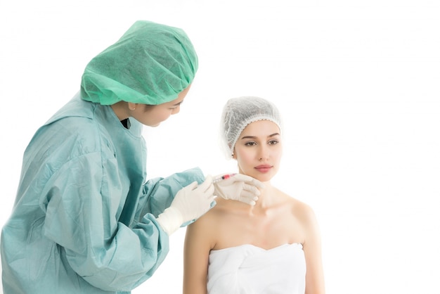 Photo beautiful young woman receiving botox injection isolated on white background. beauty concept.