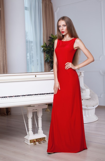 Beautiful young woman in a red dress