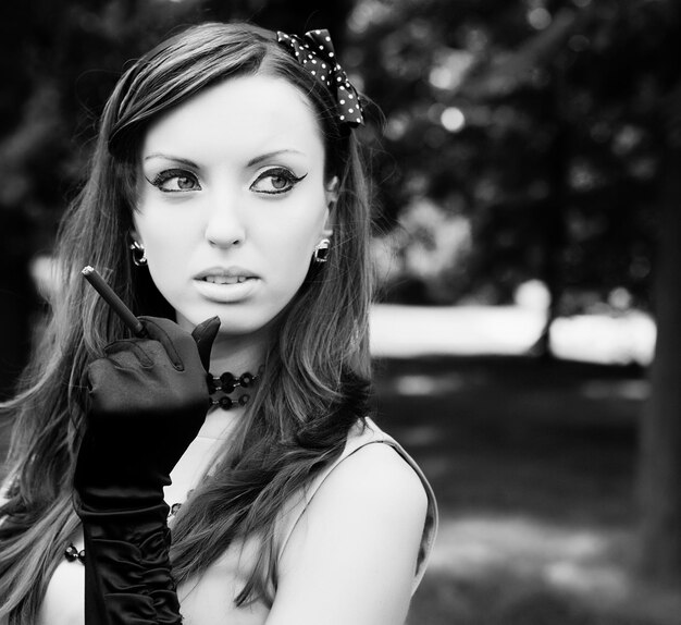 Beautiful young woman relaxing at park