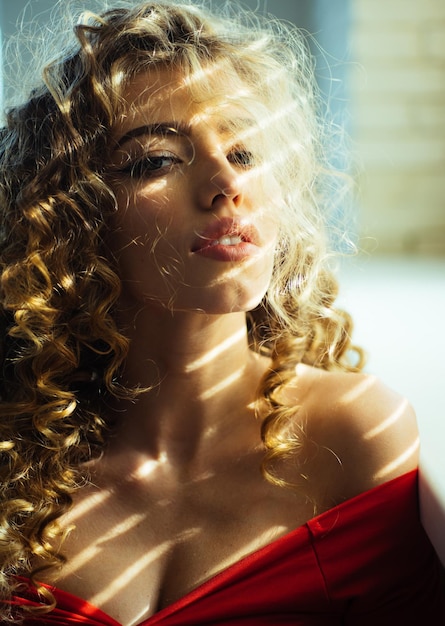 Beautiful young woman shiny curly hair beautiful model woman with wavy hairstyle pretty woman with c...