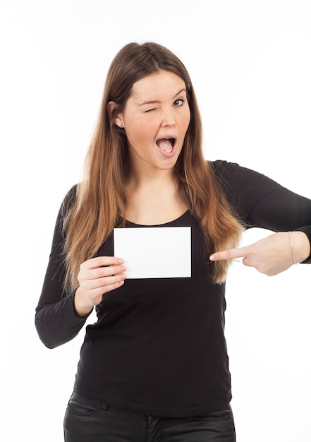 Beautiful young woman showing blank signboard