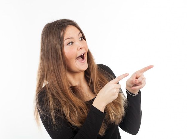 Beautiful young woman showing blank signboard