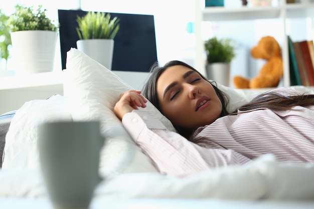 Beautiful young woman sleeping peacefully in bed