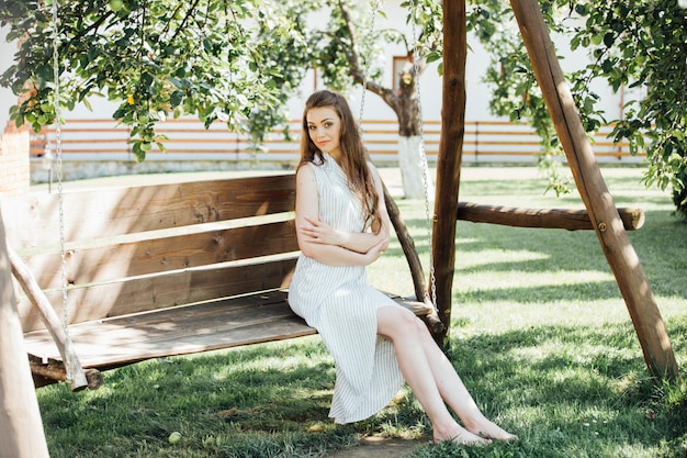 A beautiful young woman smiling outdoors.