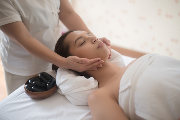 Beautiful young woman in spa salon 