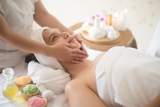 Beautiful young woman in spa salon 