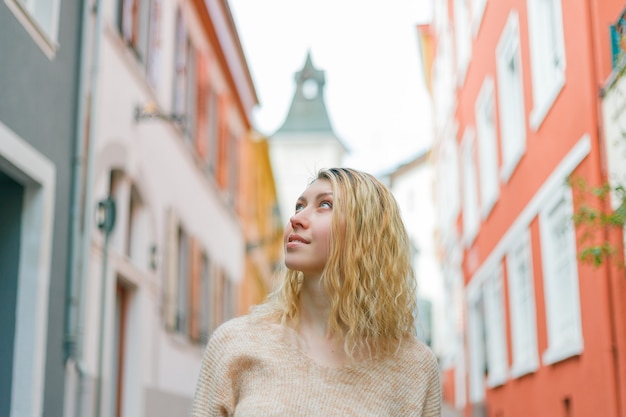 Beautiful young woman on the street of a European city