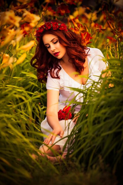 Beautiful young woman in the summer garden