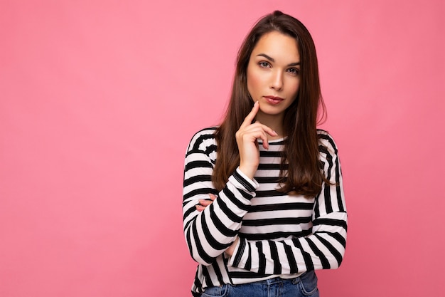 Beautiful young woman thinking