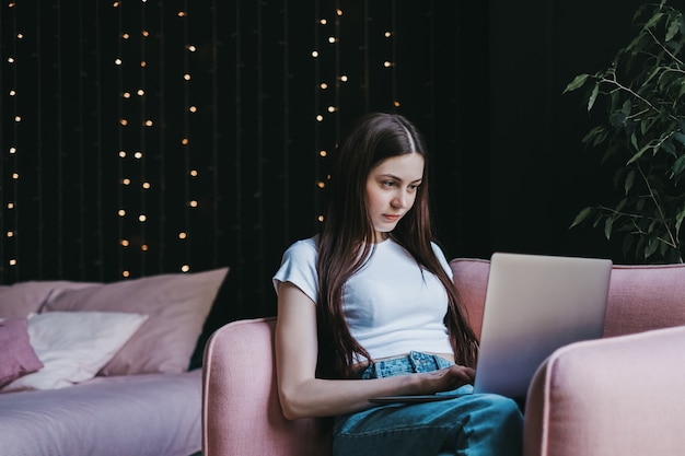 Beautiful young woman using a laptop