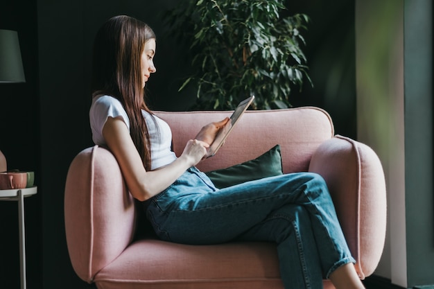 Beautiful young woman using a tablet