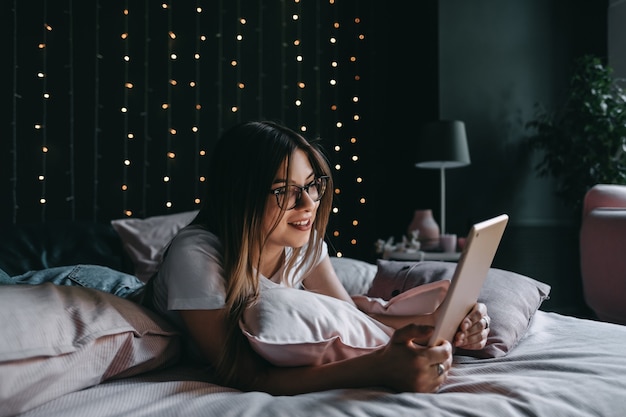 Beautiful young woman using a tablet