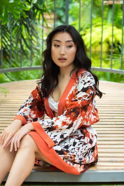 Beautiful young woman wearing summer clothes on tropical resort