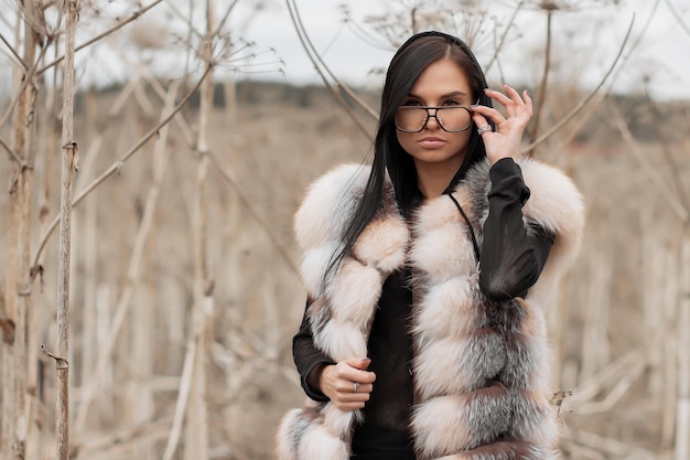 Beautiful young woman in a wheat golden field