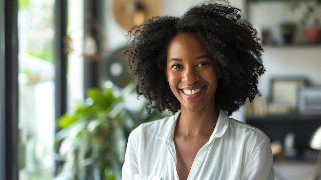 Beautiful young woman with afro hair smiling She is wearing a white shirt and has a confident expression on her face
