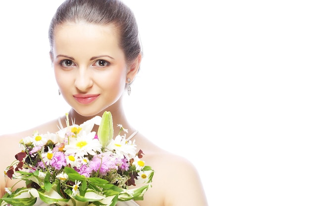 Beautiful young woman with bouquet flowers