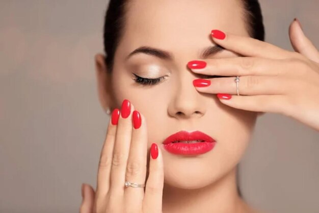 Beautiful young woman with bright manicure