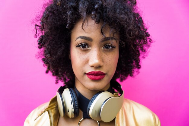 Beautiful young woman with curly black hair