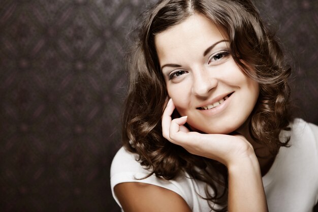 Beautiful young woman with curly hair