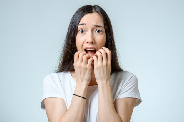 Beautiful young woman with a fear expression