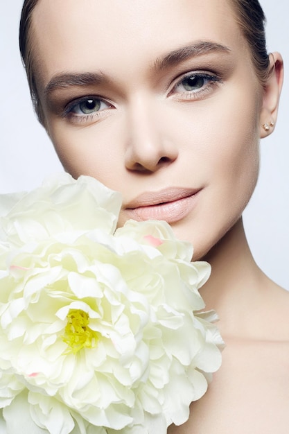 Beautiful young Woman with Flower