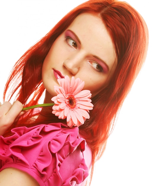 Beautiful young woman with gerber flower