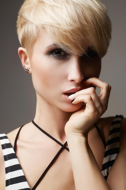 Beautiful young woman with hort haircut