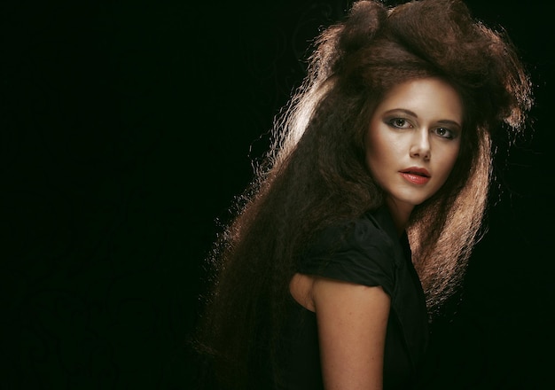 Beautiful young woman with magnificent hairdo