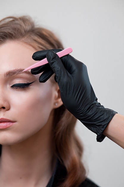 Beautiful young woman with make-up in a black shirt