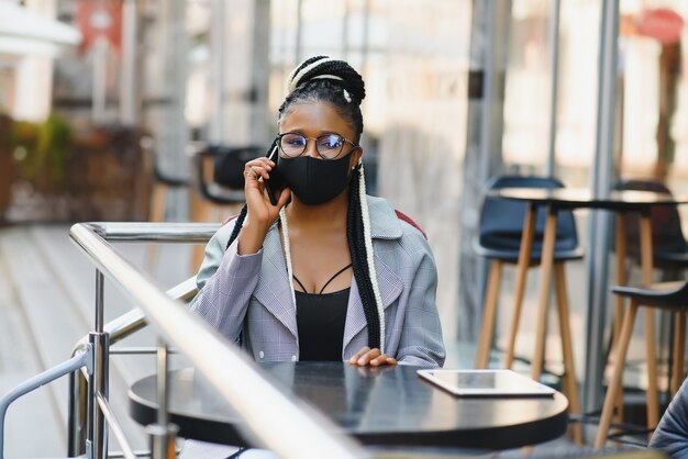 Beautiful young woman with a mask