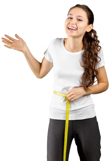 Beautiful young woman with measuring tape, isolated