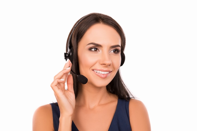 Beautiful young woman with microphone and headphone smiling