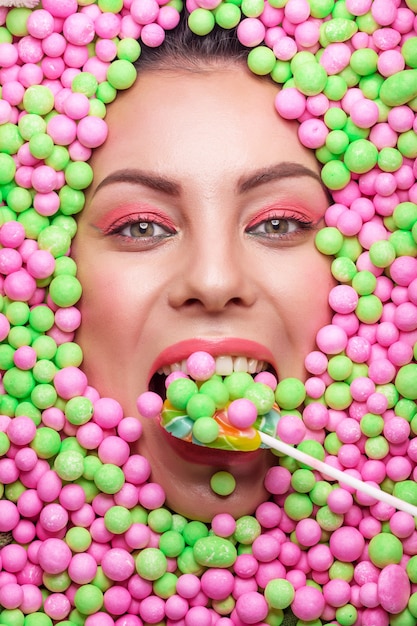 beautiful young woman with multicolored candies