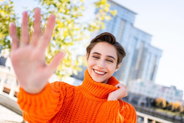 Beautiful young woman with short hair in the city