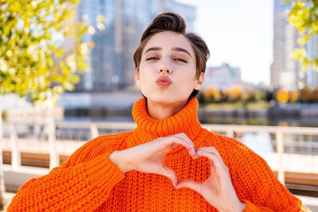 Beautiful young woman with short hair in the city