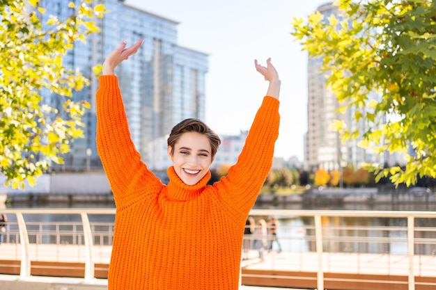 Beautiful young woman with short hair in the city